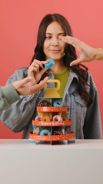 Who needs a birthday cake when you can have a whole donut tower? 🎉🍩 Make a wish… and maybe grab a second donut! 😉

   